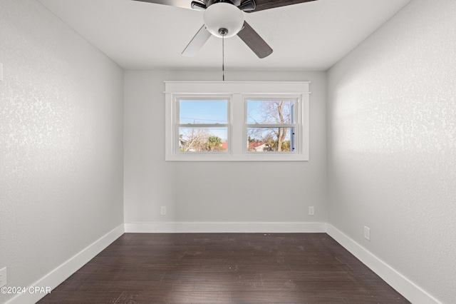 spare room featuring wood-type flooring and ceiling fan