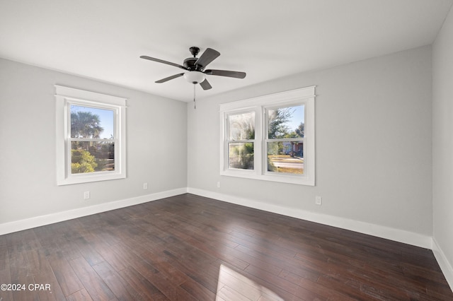 unfurnished room with ceiling fan and dark hardwood / wood-style floors