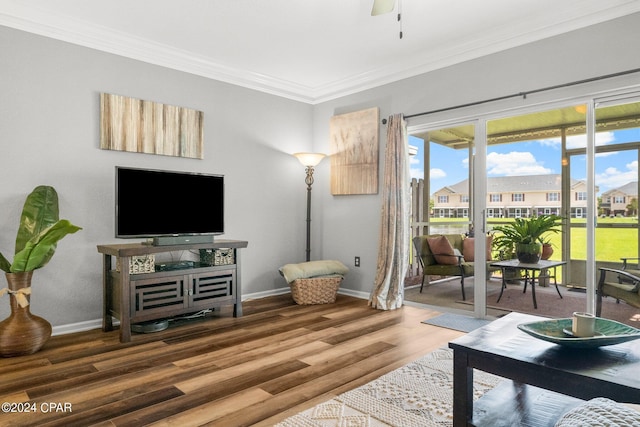 living room with hardwood / wood-style floors, ceiling fan, ornamental molding, and a wealth of natural light