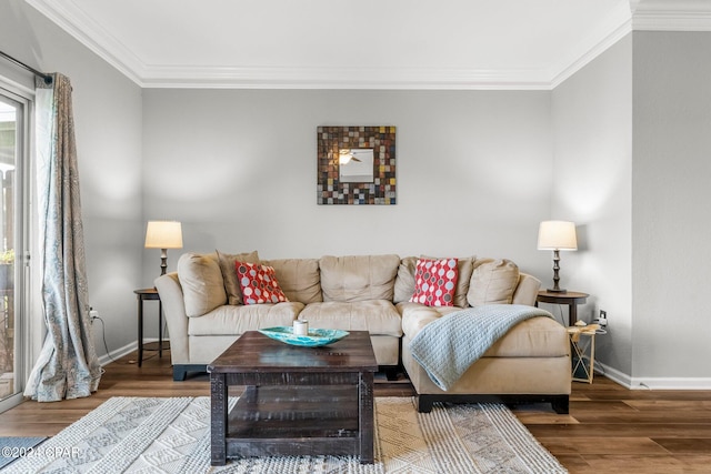 living room featuring wood-type flooring and ornamental molding