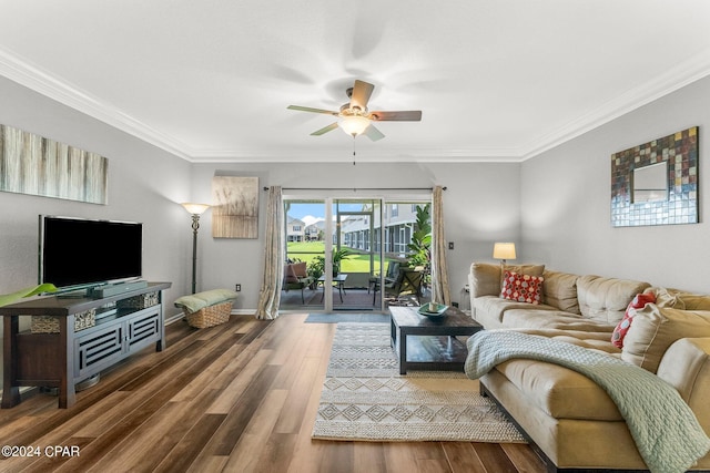 living room featuring ceiling fan, dark hardwood / wood-style flooring, and ornamental molding