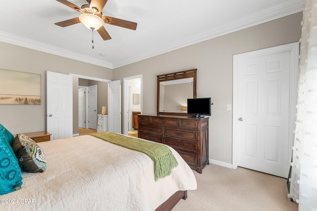 bedroom featuring connected bathroom, ceiling fan, light carpet, and ornamental molding