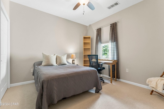 carpeted bedroom with ceiling fan