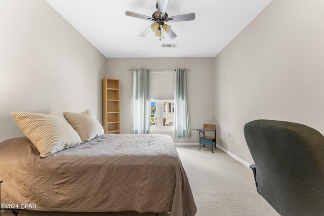 bedroom with ceiling fan and light colored carpet