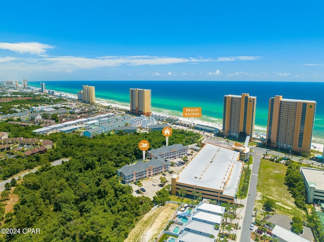 bird's eye view featuring a water view and a view of the beach