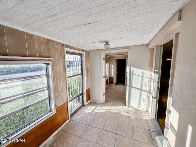 unfurnished sunroom featuring plenty of natural light