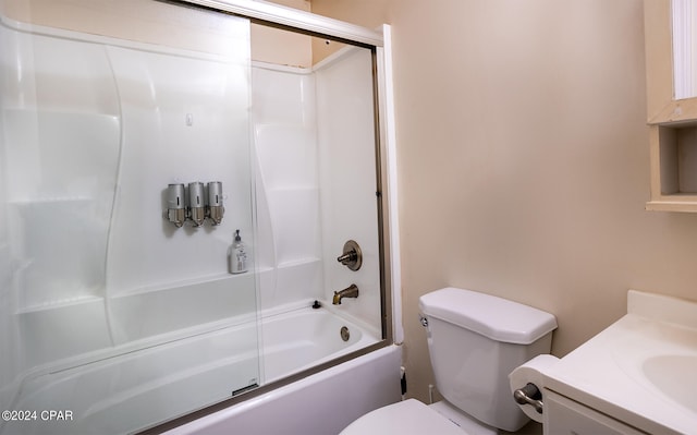 full bathroom featuring toilet, combined bath / shower with glass door, and vanity