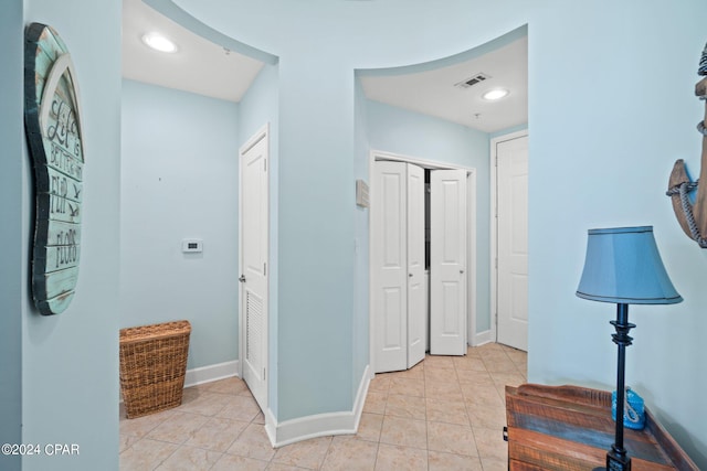 hallway with light tile patterned flooring