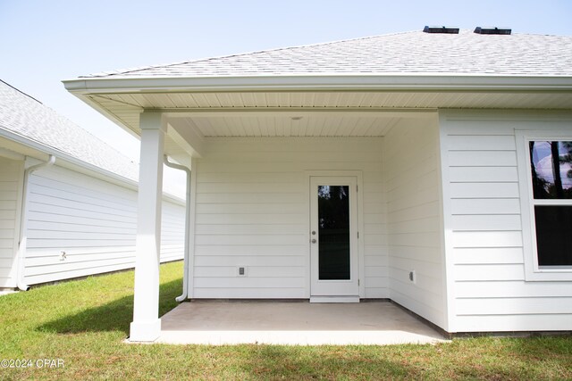 view of front of property with a garage and a front lawn