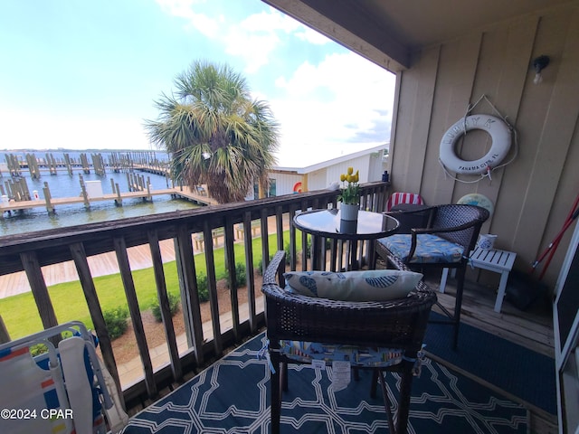 balcony featuring a water view