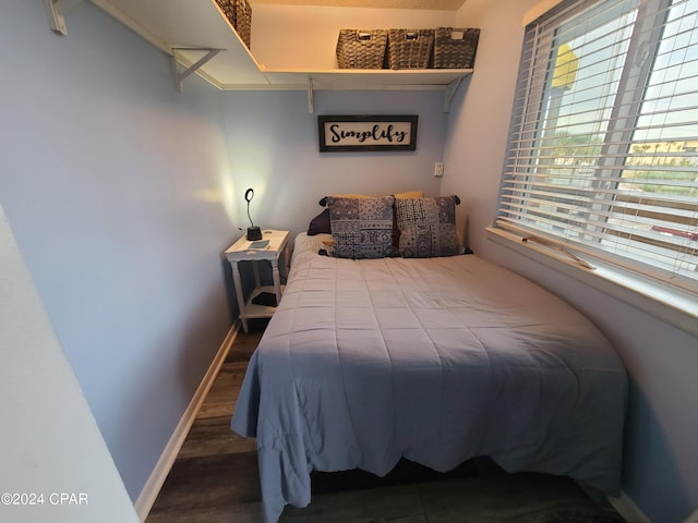 bedroom featuring wood-type flooring