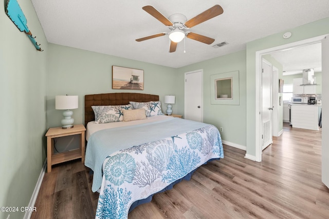 bedroom featuring wood-type flooring and ceiling fan