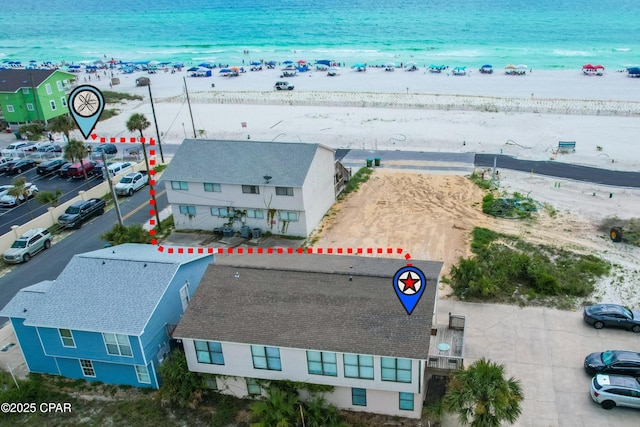 bird's eye view with a beach view and a water view