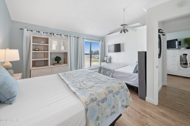 bedroom with lofted ceiling, hardwood / wood-style floors, and ceiling fan