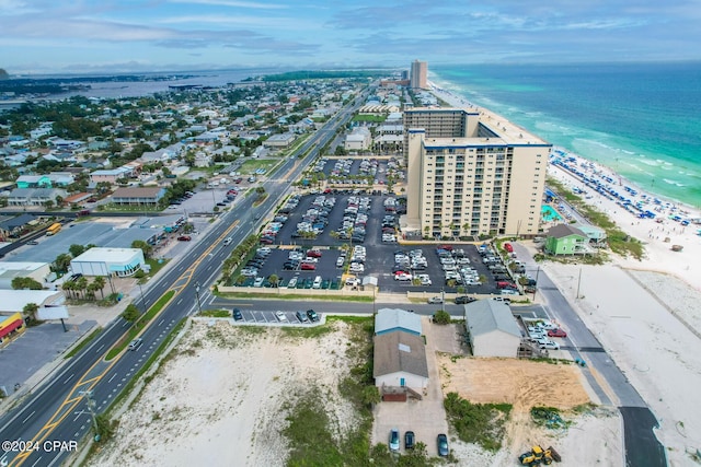 drone / aerial view featuring a view of the beach and a water view