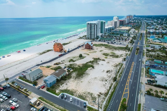 birds eye view of property featuring a water view and a view of the beach