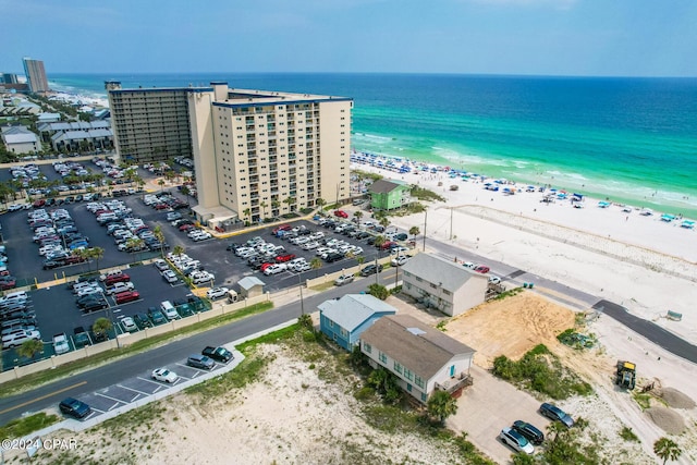 bird's eye view featuring a beach view and a water view