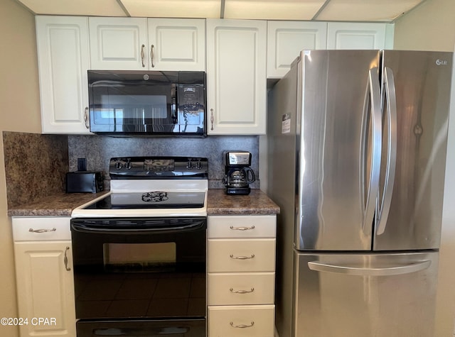 kitchen with black appliances, white cabinetry, and backsplash