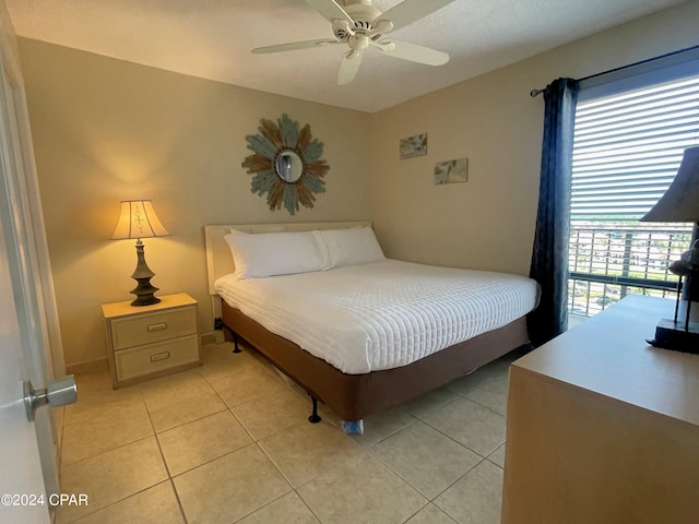 tiled bedroom with ceiling fan