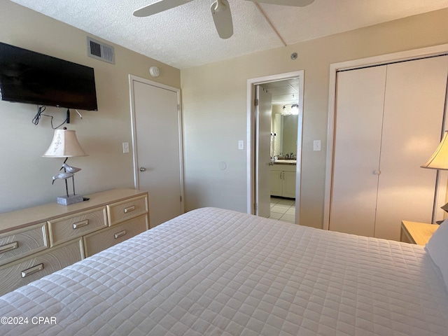 bedroom featuring a textured ceiling and ceiling fan