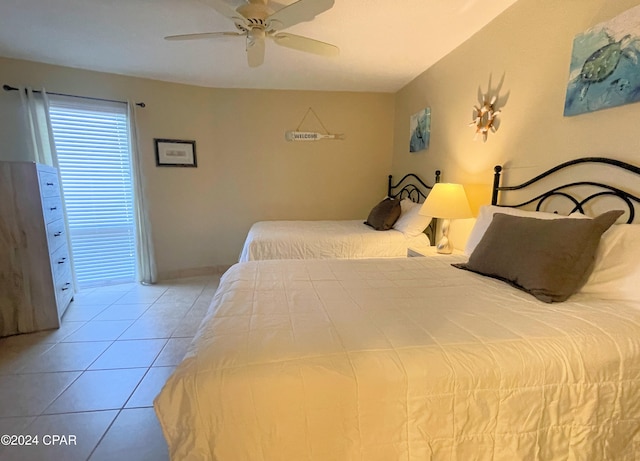 bedroom featuring ceiling fan and light tile patterned flooring