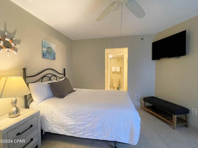 bedroom with connected bathroom, tile patterned flooring, and ceiling fan