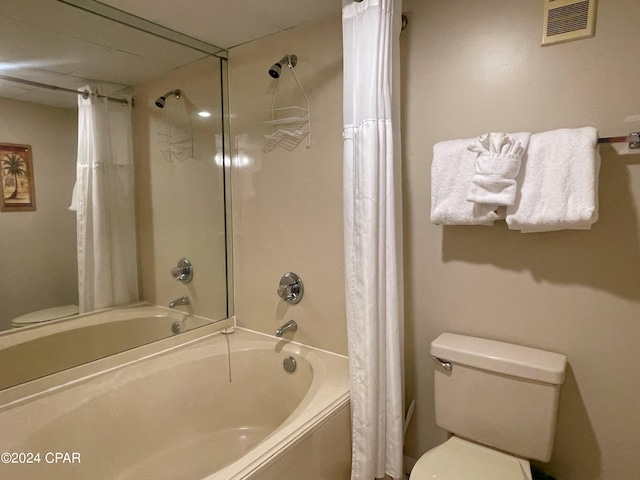 bathroom with shower / tub combo and toilet