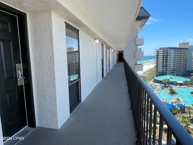 balcony featuring a water view