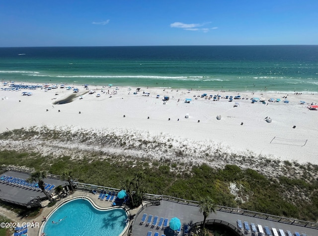 aerial view featuring a view of the beach and a water view