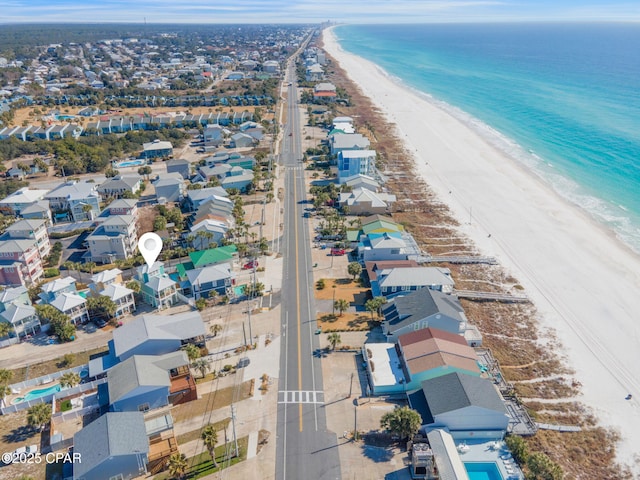 birds eye view of property featuring a water view and a view of the beach