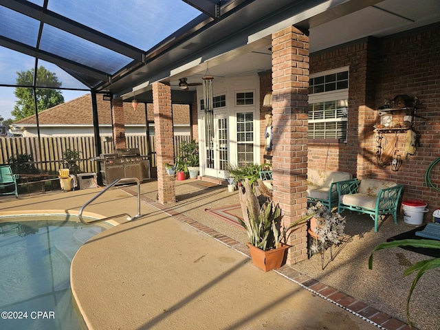 view of patio / terrace with french doors, a fenced in pool, a lanai, and ceiling fan