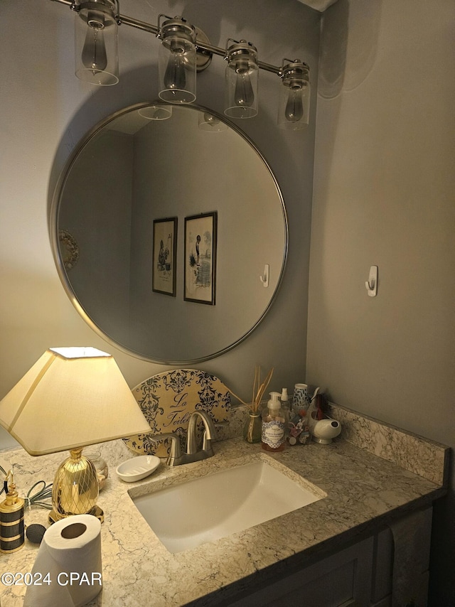 bathroom with ceiling fan and vanity