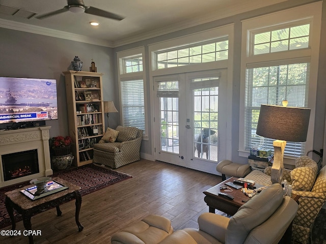 living room with wood-type flooring, ceiling fan, french doors, and plenty of natural light