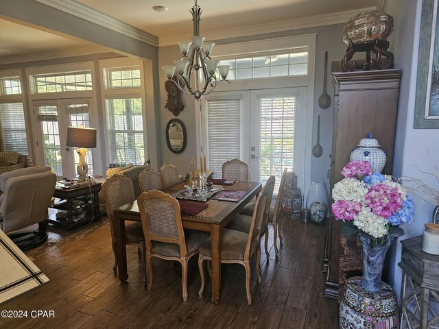 dining room with crown molding, french doors, and dark hardwood / wood-style flooring