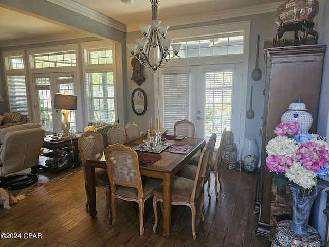 dining space featuring french doors, ornamental molding, and dark hardwood / wood-style flooring