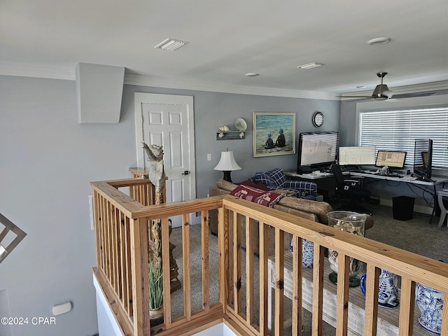 interior space with ceiling fan and crown molding