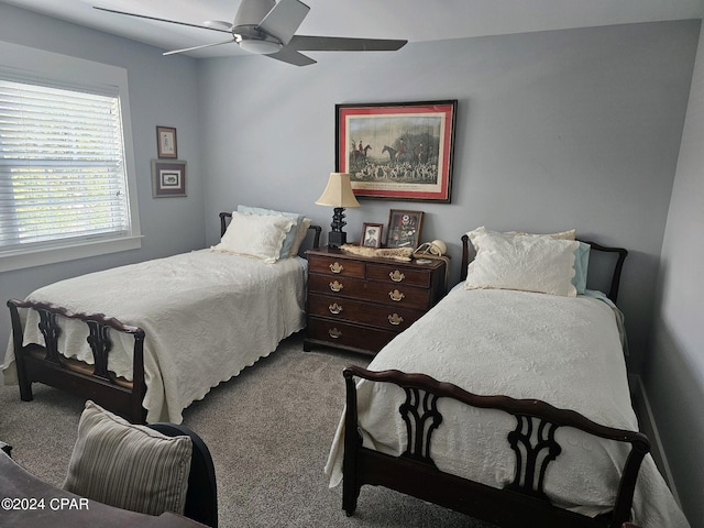 bedroom with ceiling fan and carpet floors