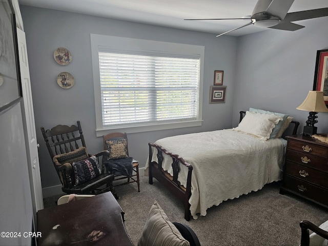 bedroom with ceiling fan and carpet