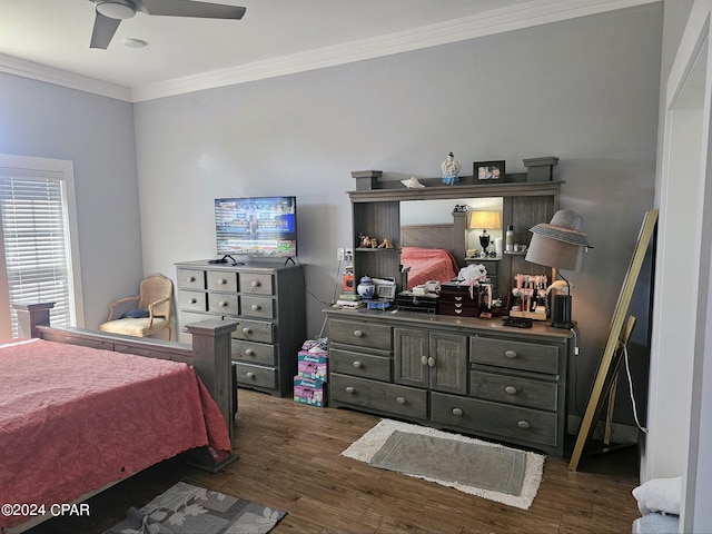 bedroom with ornamental molding, ceiling fan, and dark hardwood / wood-style flooring