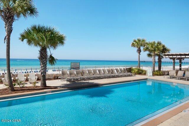 view of pool featuring a water view