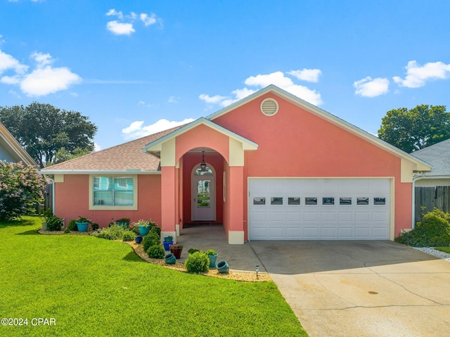 single story home with an attached garage, driveway, roof with shingles, stucco siding, and a front yard