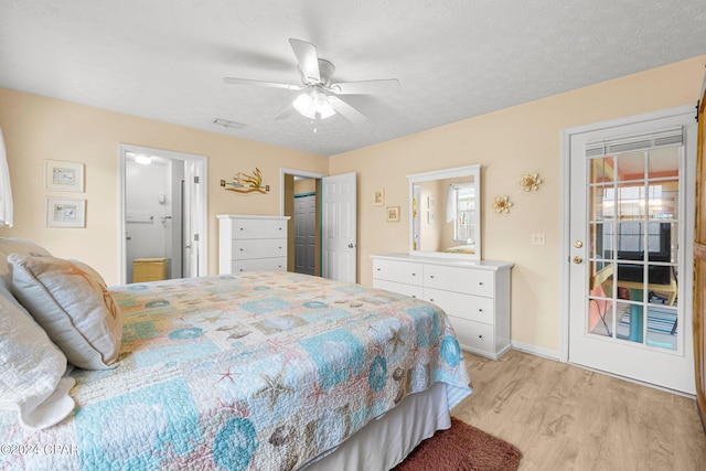 bedroom with a textured ceiling, connected bathroom, light wood-style flooring, and baseboards