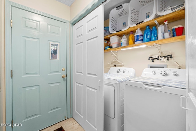 washroom with laundry area, light wood finished floors, and independent washer and dryer