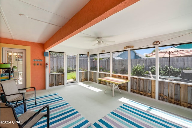 sunroom with a ceiling fan