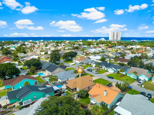 bird's eye view with a residential view and a water view