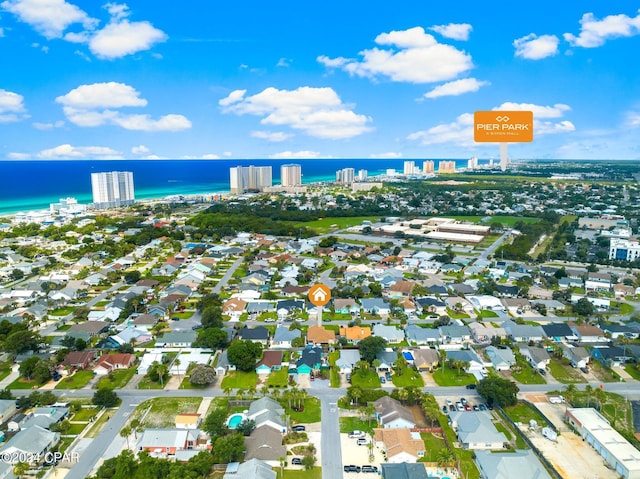 drone / aerial view featuring a water view and a residential view