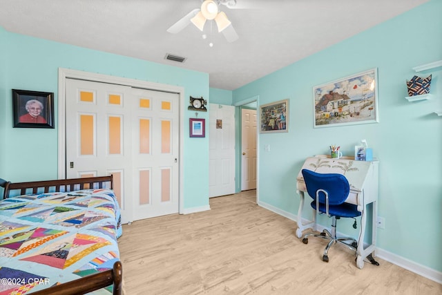 bedroom with baseboards, visible vents, and light wood-style floors