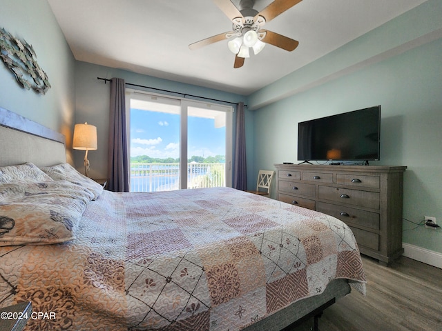 bedroom with access to outside, hardwood / wood-style flooring, and ceiling fan