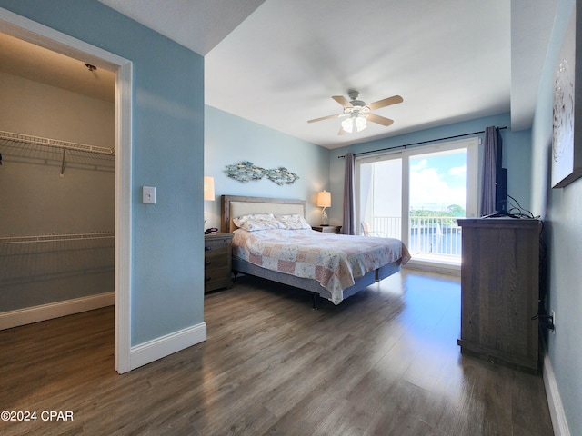 bedroom with a closet, ceiling fan, hardwood / wood-style flooring, a walk in closet, and access to outside