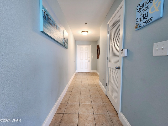 hall with light tile patterned flooring